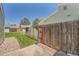 Fenced backyard with healthy grass, plus a concrete patio and privacy at 16149 E Rice Pl # A, Aurora, CO 80015