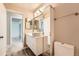Bright bathroom featuring a vessel sink, mirror and updated lighting at 16149 E Rice Pl # A, Aurora, CO 80015