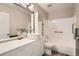 Modern bathroom features stylish vessel sink with white vanity and combination shower and tub at 16149 E Rice Pl # A, Aurora, CO 80015