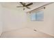 This bedroom includes a window with blinds and a ceiling fan at 16149 E Rice Pl # A, Aurora, CO 80015