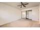 This bedroom includes a ceiling fan, mirrored closet doors and ample storage at 16149 E Rice Pl # A, Aurora, CO 80015