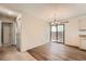 Bright dining area featuring wood-look floors and sliding glass doors to the backyard at 16149 E Rice Pl # A, Aurora, CO 80015