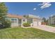 Quaint home with attached two-car garage and a well-manicured lawn and landscaping at 16149 E Rice Pl # A, Aurora, CO 80015
