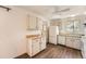 Functional kitchen with white appliances, ceiling fan, ample cabinet space, and wood-look floors at 16149 E Rice Pl # A, Aurora, CO 80015