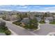 Aerial shot of the home and surroundings showcasing a well-maintained lawn and mountain views at 9391 W Hialeah Pl, Littleton, CO 80123