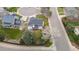 An aerial view of a well-maintained home with a spacious yard and mature trees in a quiet neighborhood at 9391 W Hialeah Pl, Littleton, CO 80123