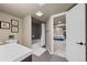 View of a bathroom and a doorway showing a connecting bedroom at 9391 W Hialeah Pl, Littleton, CO 80123
