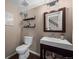Charming bathroom featuring a modern sink, mirror, and tasteful decor at 9391 W Hialeah Pl, Littleton, CO 80123