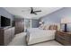 Tranquil bedroom features carpet, a ceiling fan, and natural light at 9391 W Hialeah Pl, Littleton, CO 80123