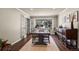 Elegant dining room with a large window and hardwood floors at 9391 W Hialeah Pl, Littleton, CO 80123