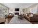 Relaxing living room with a brick fireplace and comfortable seating at 9391 W Hialeah Pl, Littleton, CO 80123
