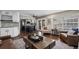 The open layout of the kitchen and living area create a seamless transition for everyday living and entertaining at 9391 W Hialeah Pl, Littleton, CO 80123