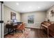 Bright home office with a large window and hardwood floors at 9391 W Hialeah Pl, Littleton, CO 80123