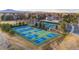 Aerial view of community tennis courts showcasing well-maintained facilities and surrounding landscape at 9391 W Hialeah Pl, Littleton, CO 80123