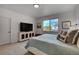 Serene bedroom features a large window, soft carpet, and a rustic media center at 10380 W 55Th Ln # 204, Arvada, CO 80002