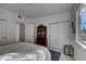 Spacious bedroom with ample closet space, soft carpet, and natural light from the large window at 10380 W 55Th Ln # 204, Arvada, CO 80002