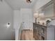 Hallway with a cabinet, mirror, lamp and wood-style floors at 10380 W 55Th Ln # 204, Arvada, CO 80002