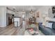Open floor plan with a living room, dining area, and kitchen, creating a spacious and inviting atmosphere at 10380 W 55Th Ln # 204, Arvada, CO 80002