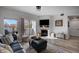 Bright living room featuring a fireplace, sliding glass doors, and contemporary decor at 10380 W 55Th Ln # 204, Arvada, CO 80002