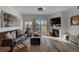 Comfortable living room with a fireplace, sliding glass doors, and contemporary decor at 10380 W 55Th Ln # 204, Arvada, CO 80002