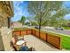 Relaxing outdoor patio space with wood fence perfect for entertaining and enjoying the outdoors at 12433 Bellaire Dr, Thornton, CO 80241