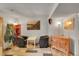 Cozy basement area with tile flooring, seating area, and neutral colored walls at 12433 Bellaire Dr, Thornton, CO 80241
