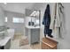 Bright bathroom with a soaking tub, modern vanity, and decorative accents at 12433 Bellaire Dr, Thornton, CO 80241