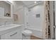 Beautiful bathroom with subway tile, shower, and a white vanity at 12433 Bellaire Dr, Thornton, CO 80241