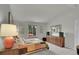 Bright bedroom with a patchwork quilt, large window, and spacious layout at 12433 Bellaire Dr, Thornton, CO 80241