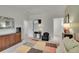 Spacious bedroom with a TV, side tables, and a colorful quilt on the bed at 12433 Bellaire Dr, Thornton, CO 80241