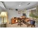 Bright home office with a large desk, a comfortable chair, and natural light at 12433 Bellaire Dr, Thornton, CO 80241