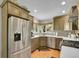 Modern kitchen featuring stainless steel appliances, ample cabinet space, and natural light at 12433 Bellaire Dr, Thornton, CO 80241