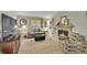 Cozy living room with a fireplace, comfortable sofa, and bright natural light at 12433 Bellaire Dr, Thornton, CO 80241