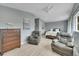 Spacious main bedroom with hardwood floors, neutral walls, and cozy seating area at 12433 Bellaire Dr, Thornton, CO 80241