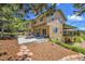 Large backyard with a patio, outdoor seating, and mature landscaping at 25741 E Kettle Cir, Aurora, CO 80016