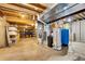 Unfinished basement for storage with modern appliances and lighting at 25741 E Kettle Cir, Aurora, CO 80016