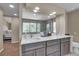 Bright bathroom with double sink vanity, large mirror, and decorative wood cabinets at 25741 E Kettle Cir, Aurora, CO 80016