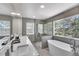 Modern bathroom featuring a soaking tub, walk-in shower, and dual sink vanity at 25741 E Kettle Cir, Aurora, CO 80016