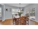 Cozy dining room with hardwood floors, natural light, and a view to the yard at 25741 E Kettle Cir, Aurora, CO 80016