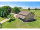 An aerial view of a house with a covered porch, manicured lawn and large trees in a serene, peaceful setting at 25741 E Kettle Cir, Aurora, CO 80016