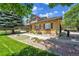 Charming home featuring well-manicured landscaping, flower boxes and a stone walkway at 25741 E Kettle Cir, Aurora, CO 80016