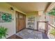 Welcoming front porch with a decorative door, plants, and a stylish welcome sign at 25741 E Kettle Cir, Aurora, CO 80016