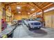 Spacious garage with high ceilings, abundant storage, a truck, and modern lighting at 25741 E Kettle Cir, Aurora, CO 80016