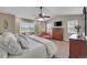 Spacious main bedroom with natural light, large window, ceiling fan and an ensuite bathroom at 25741 E Kettle Cir, Aurora, CO 80016