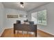 Home office with a large desk, hardwood floors and a window providing natural light at 25741 E Kettle Cir, Aurora, CO 80016