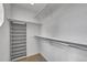 Walk-in closet with racks and shelves for clothing and shoe storage at 25741 E Kettle Cir, Aurora, CO 80016