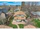 Aerial view of the backyard, showcasing the patio, landscaping, and proximity to the surrounding neighborhood at 1230 S Emerson St Dr, Denver, CO 80210