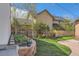 Beautifully landscaped backyard with flowers, greenery, and a brick patio, perfect for outdoor enjoyment at 1230 S Emerson St Dr, Denver, CO 80210