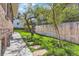Green backyard with healthy grass, stone steps, and privacy fence at 1230 S Emerson St Dr, Denver, CO 80210