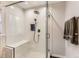 Walk in shower with bench and white marble tile at 1230 S Emerson St Dr, Denver, CO 80210